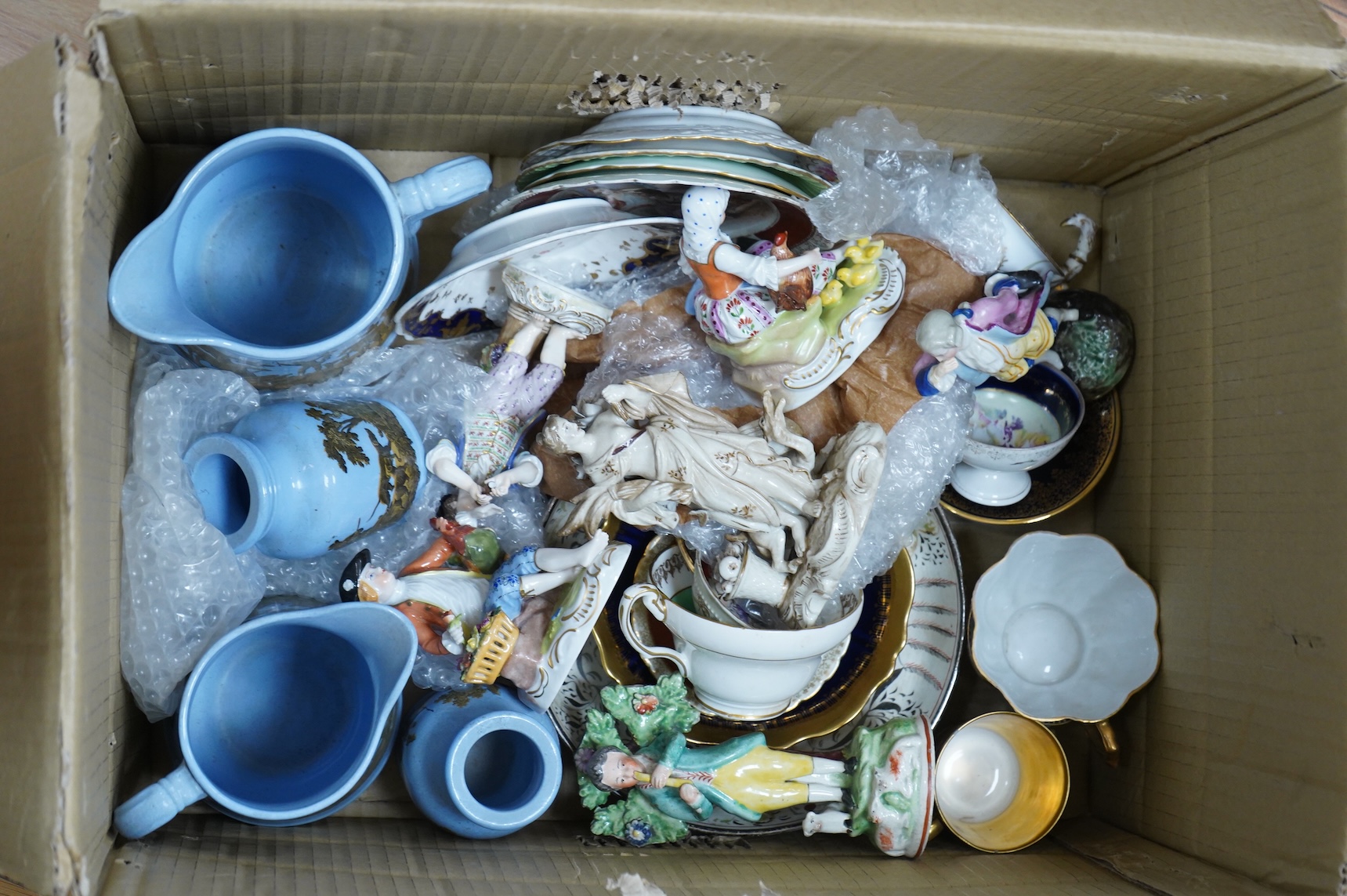 A collection of mixed ceramics including a Dresden figure and cabinet cups and saucers